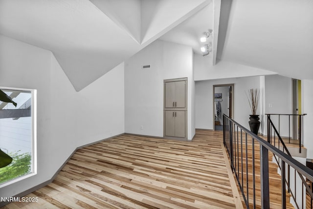 4307 Clyde Ct, Reno, NV 89509 - additional living space with vaulted ceiling and light wood-style flooring