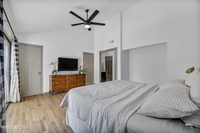 4307 Clyde Ct, Reno, NV 89509 - bedroom featuring light wood-style floors, high vaulted ceiling, and a ceiling fan