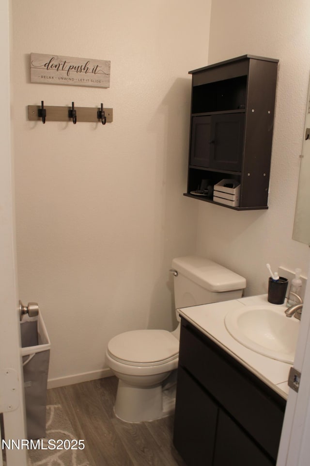 1311 Yellowjacket Ln, Gardnerville, NV 89460 - bathroom with wood finished floors, toilet, and vanity