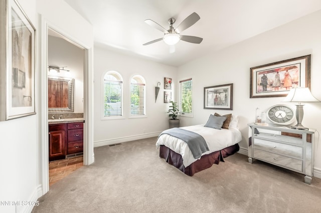 14200 Wild Quail Ct, Reno, NV 89511 - bedroom with light carpet, connected bathroom, baseboards, and a ceiling fan