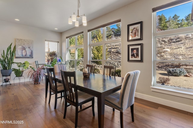 4069 Whispering Pine Loop, Reno, NV 89519 - dining room with baseboards, dark wood-style flooring, plenty of natural light, a chandelier, and recessed lighting