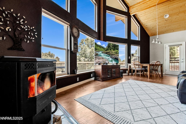2140 Conestoga Rd, Reno, NV 89521 - living area featuring wood finished floors, high vaulted ceiling, wood ceiling with exposed beams, baseboards, and a chandelier