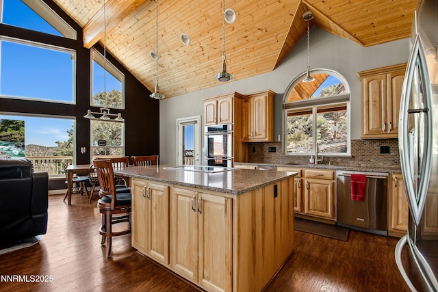 2140 Conestoga Rd, Reno, NV 89521 - kitchen featuring stainless steel appliances, a center island, high vaulted ceiling, light brown cabinets, and wood ceiling with exposed beams