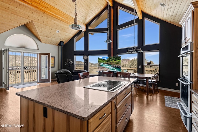 2140 Conestoga Rd, Reno, NV 89521 - kitchen with a warming drawer, black electric stovetop, wood ceiling with exposed beams, open floor plan, and dark wood-style floors
