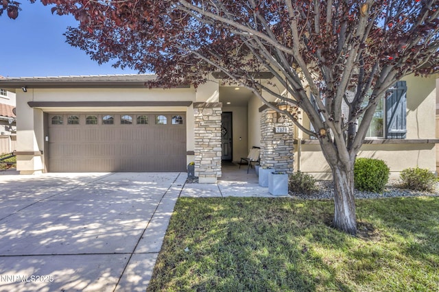 2028 Whitecliff Dr, Reno, NV 89521 - view of front of house featuring stucco siding, driveway, stone siding, a garage, and a front lawn