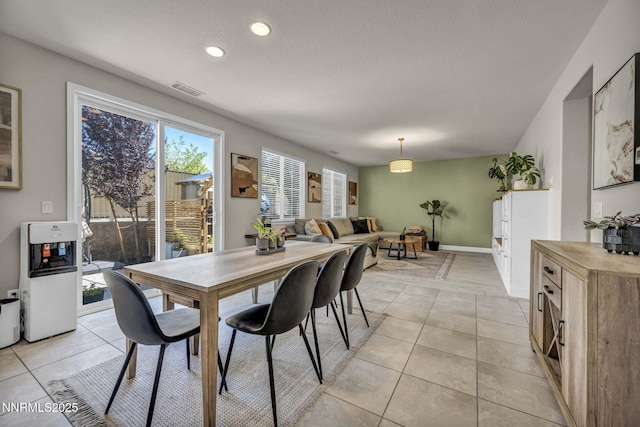 2028 Whitecliff Dr, Reno, NV 89521 - dining area with light tile patterned floors, recessed lighting, a textured ceiling, and baseboards