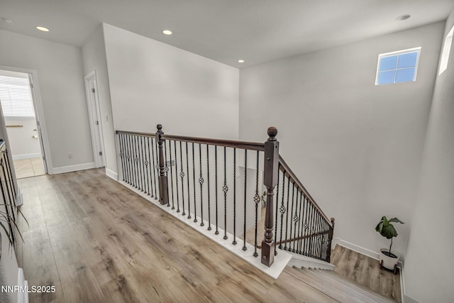 2028 Whitecliff Dr, Reno, NV 89521 - corridor featuring wood finished floors, an upstairs landing, recessed lighting, and baseboards