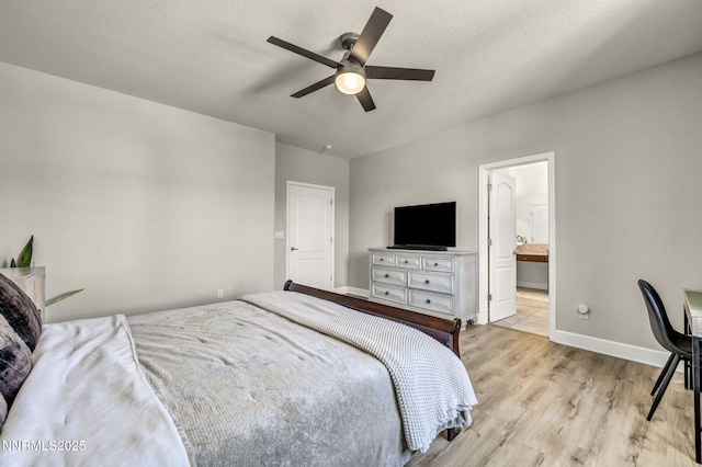 2028 Whitecliff Dr, Reno, NV 89521 - bedroom featuring light wood finished floors, baseboards, ensuite bathroom, and ceiling fan