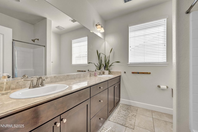 2028 Whitecliff Dr, Reno, NV 89521 - bathroom with double vanity, tile patterned floors, a shower, and baseboards
