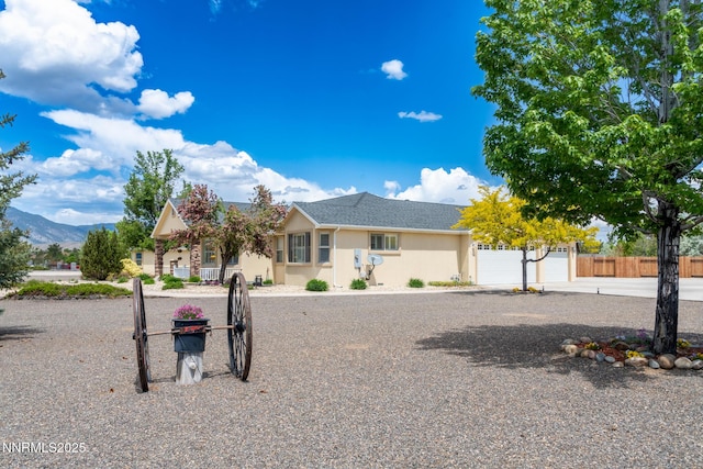 1184 Stephanie Way, Minden, NV 89423 - view of front of property with a mountain view and stucco siding
