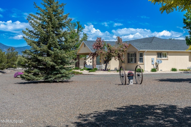 1184 Stephanie Way, Minden, NV 89423 - view of front of house with stucco siding, a mountain view, and roof with shingles