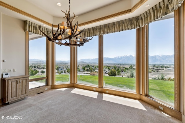 1103 Cortez Ln, Gardnerville, NV 89410 - unfurnished sunroom featuring a chandelier, carpet flooring, a mountain view, and recessed lighting