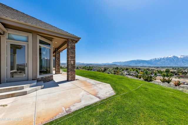 1103 Cortez Ln, Gardnerville, NV 89410 - view of grassy yard featuring a patio and a mountain view