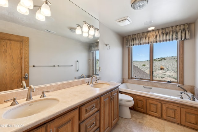 1103 Cortez Ln, Gardnerville, NV 89410 - bathroom featuring a bath, double vanity, toilet, and tile patterned floors