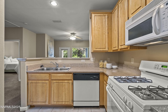 900 S Meadows Pkwy Unit 1223, Reno, NV 89521 - kitchen with white appliances, a sink, a ceiling fan, light countertops, and a peninsula