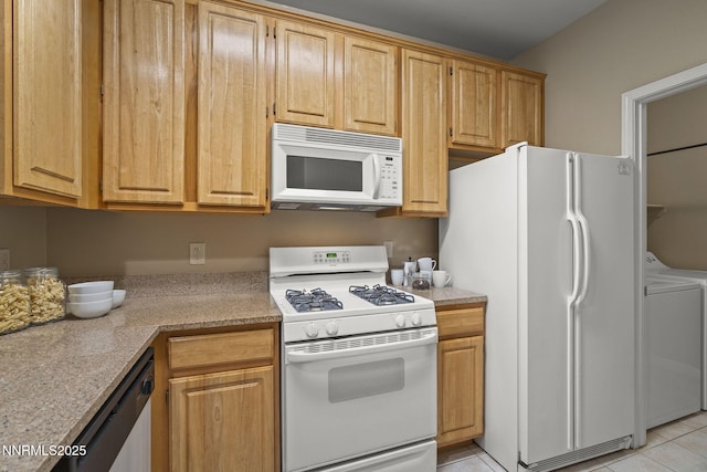 900 S Meadows Pkwy Unit 1223, Reno, NV 89521 - kitchen with white appliances, washer / dryer, and light tile patterned flooring