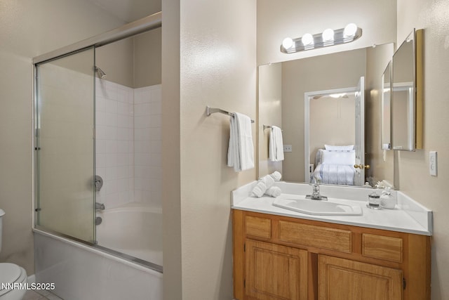 900 S Meadows Pkwy Unit 1223, Reno, NV 89521 - ensuite bathroom featuring toilet, bath / shower combo with glass door, and vanity