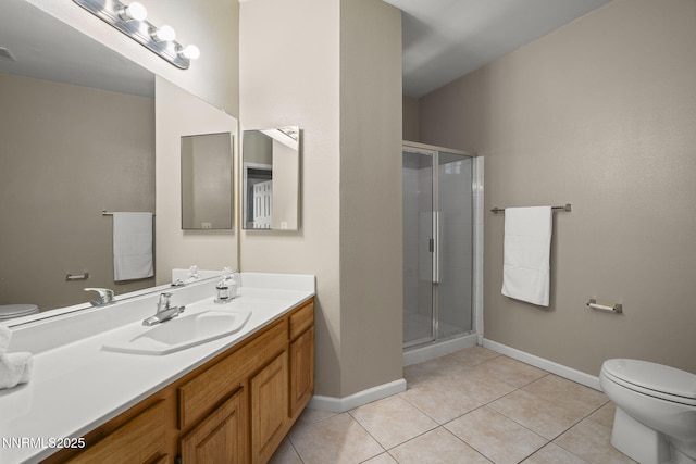 900 S Meadows Pkwy Unit 1223, Reno, NV 89521 - bathroom with toilet, tile patterned floors, baseboards, and a shower stall