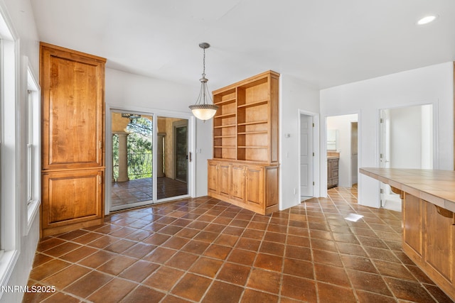 390 Sylvan Ct, Verdi, NV 89439 - kitchen with tile counters, hanging light fixtures, recessed lighting, open shelves, and brown cabinetry