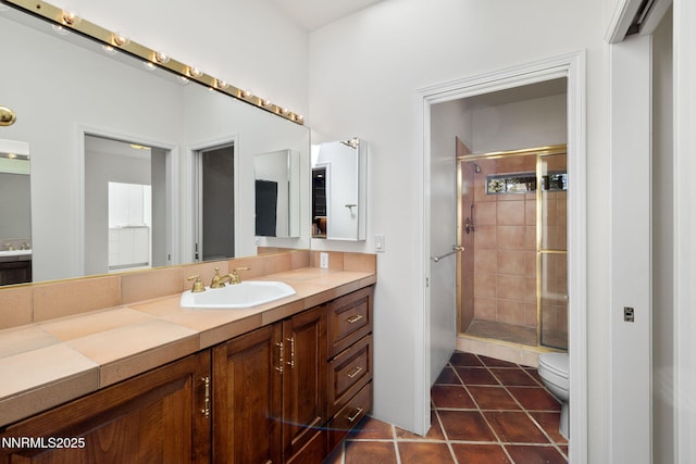 390 Sylvan Ct, Verdi, NV 89439 - full bathroom with a shower stall, vanity, toilet, and tile patterned flooring