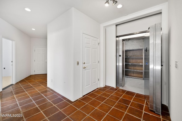 390 Sylvan Ct, Verdi, NV 89439 - corridor with recessed lighting and dark tile patterned flooring