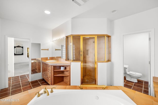 390 Sylvan Ct, Verdi, NV 89439 - bathroom featuring vanity, a stall shower, a garden tub, toilet, and recessed lighting