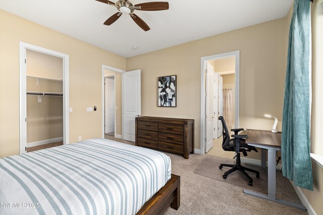 9845 Sea Breeze Ln, Reno, NV 89521 - bedroom with light colored carpet, a desk, ceiling fan, and baseboards