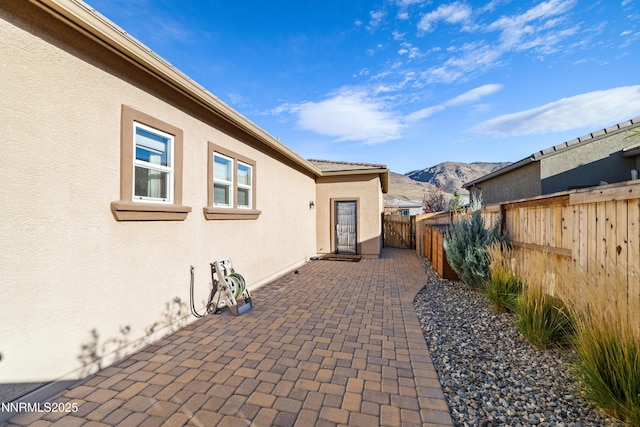 9845 Sea Breeze Ln, Reno, NV 89521 - fenced backyard with a mountain view and a patio
