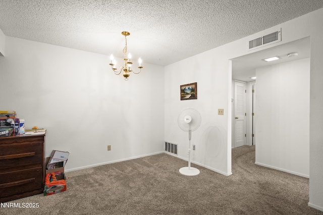 2627 Sunny Slope Dr, Sparks, NV 89434 - carpeted spare room with a chandelier, a textured ceiling, and baseboards