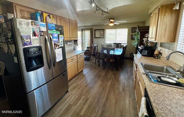 2265 Dakota Way, Reno, NV 89506 - kitchen featuring stainless steel fridge, a sink, light countertops, dark wood finished floors, and ceiling fan