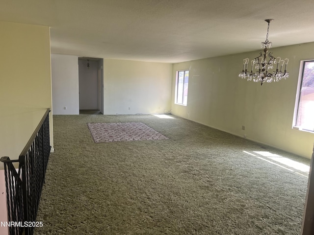 124 Mark Twain Ave, Reno, NV 89509 - spare room featuring carpet floors and a chandelier