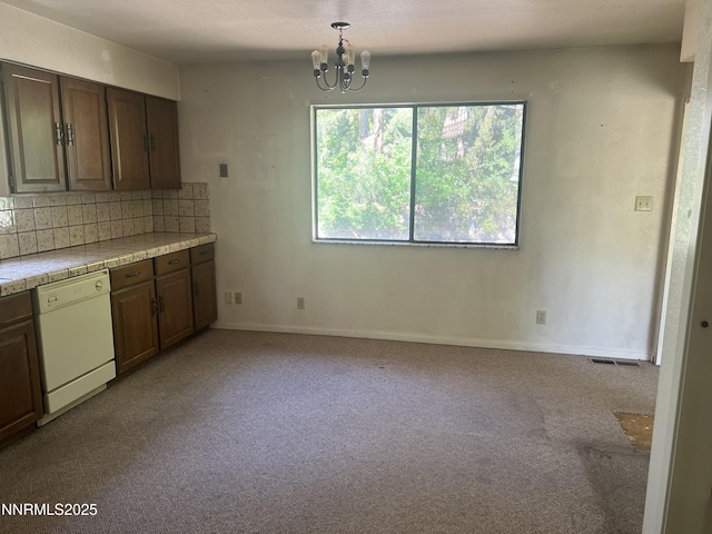 124 Mark Twain Ave, Reno, NV 89509 - kitchen with dishwasher, carpet floors, a chandelier, and backsplash