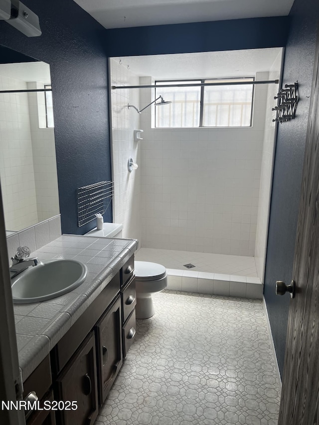 124 Mark Twain Ave, Reno, NV 89509 - full bath featuring a shower stall, toilet, vanity, and a textured wall
