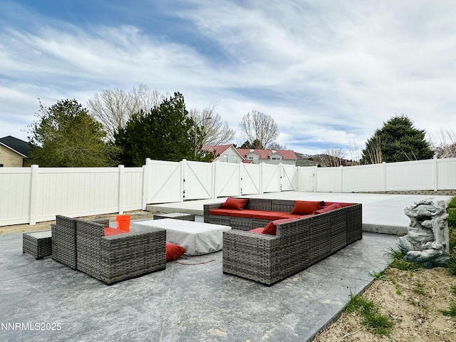 5895 Brooke Dr, Winnemucca, NV 89445 - fenced backyard featuring an outdoor hangout area, a gate, and a patio area