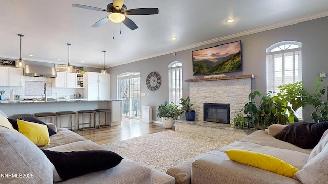 5895 Brooke Dr, Winnemucca, NV 89445 - living room with light wood-type flooring, ceiling fan, crown molding, recessed lighting, and baseboards