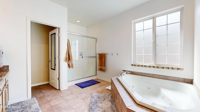 5895 Brooke Dr, Winnemucca, NV 89445 - full bath with a whirlpool tub, a stall shower, tile patterned floors, and baseboards