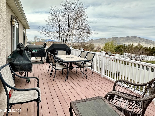 5895 Brooke Dr, Winnemucca, NV 89445 - deck with a mountain view, outdoor dining space, and a grill