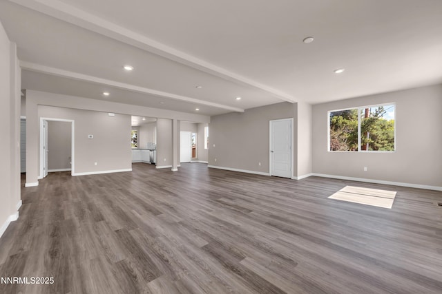 1460 Copper Point Cir, Reno, NV 89519 - unfurnished living room with recessed lighting, baseboards, dark wood-style floors, and beamed ceiling