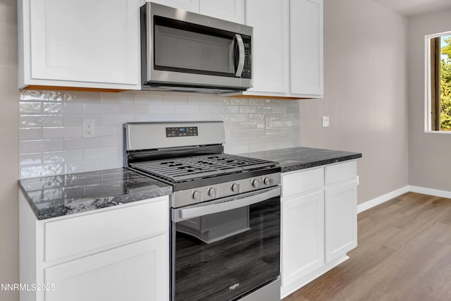 1460 Copper Point Cir, Reno, NV 89519 - kitchen featuring appliances with stainless steel finishes, baseboards, light wood-style flooring, decorative backsplash, and white cabinets