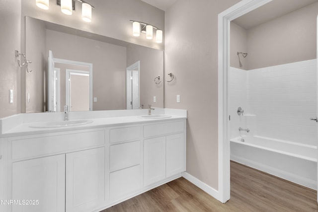 1460 Copper Point Cir, Reno, NV 89519 - full bath with wood finished floors, bathtub / shower combination, double vanity, and baseboards