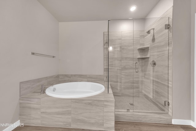 1460 Copper Point Cir, Reno, NV 89519 - bathroom featuring a bath, a stall shower, and baseboards