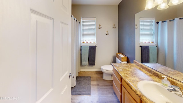 165 W National Ave, Winnemucca, NV 89445 - full bath featuring healthy amount of natural light, wood finished floors, vanity, and baseboards