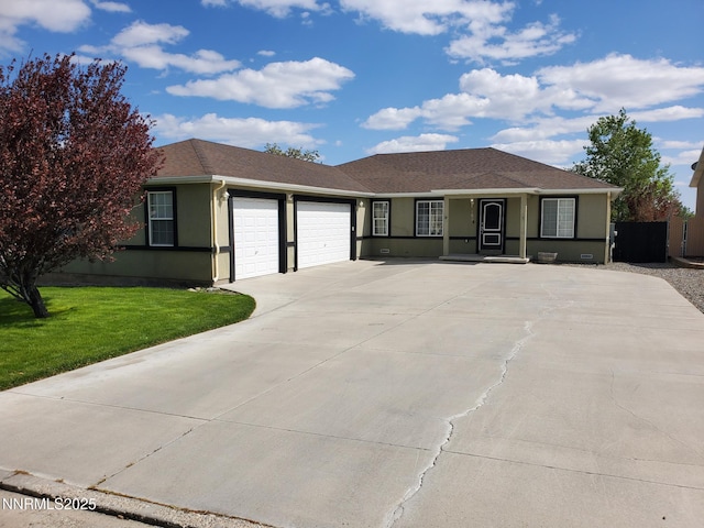 165 W National Ave, Winnemucca, NV 89445 - ranch-style home featuring an attached garage, a front yard, driveway, stucco siding, and a porch