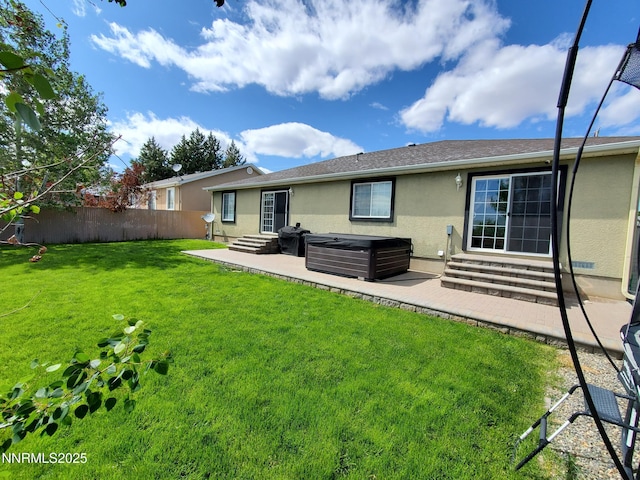 165 W National Ave, Winnemucca, NV 89445 - rear view of house featuring entry steps, stucco siding, a patio, and a hot tub