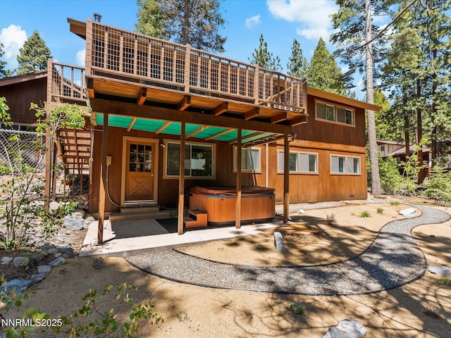 5 Ute Ct, Zephyr Cove, NV 89448 - rear view of house with a hot tub and a deck