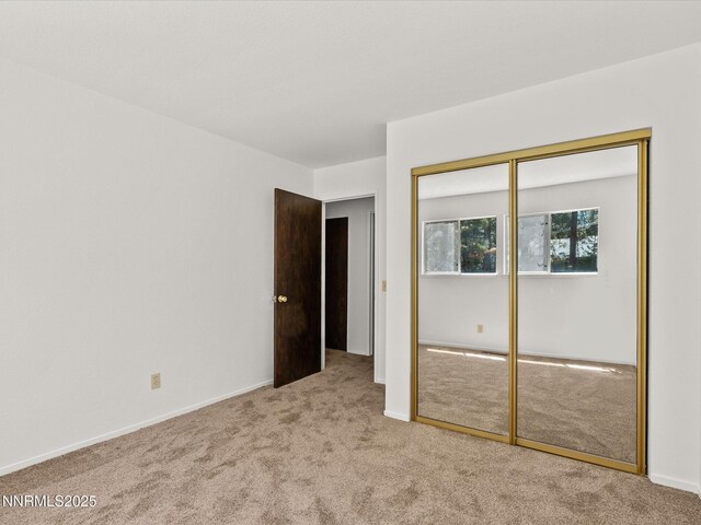 5 Ute Ct, Zephyr Cove, NV 89448 - unfurnished bedroom featuring light carpet and a closet