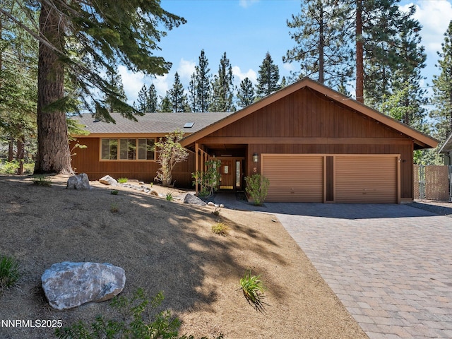 5 Ute Ct, Zephyr Cove, NV 89448 - view of front of home featuring an attached garage, decorative driveway, and roof with shingles