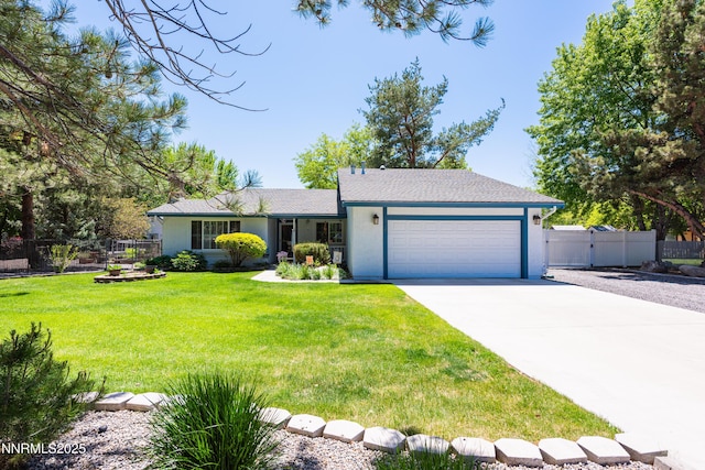 1745 Fir Tree Cir, Minden, NV 89423 - ranch-style home featuring an attached garage, driveway, a gate, and stucco siding