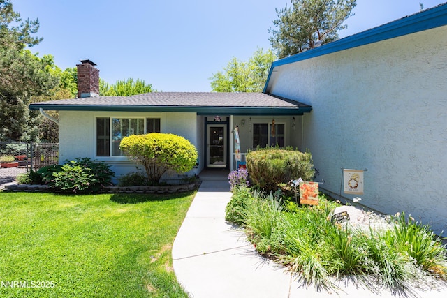 1745 Fir Tree Cir, Minden, NV 89423 - view of front of house with a front yard, stucco siding, and a chimney