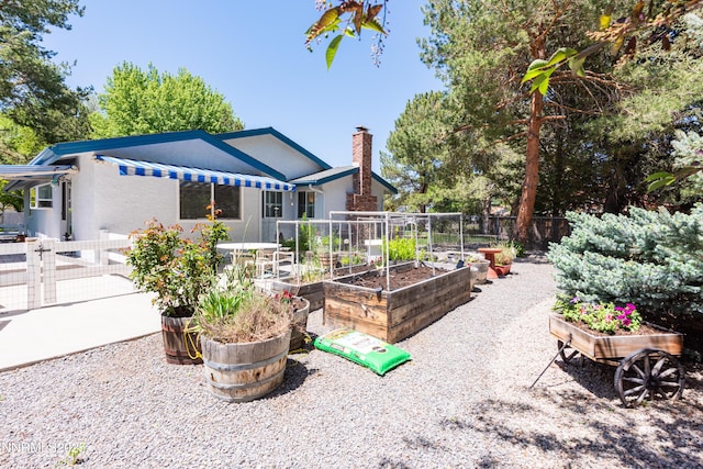 1745 Fir Tree Cir, Minden, NV 89423 - view of patio with a vegetable garden